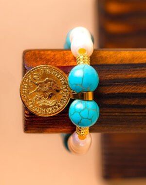 Bracelet en turquoise et perle de culture avec pendentif coq